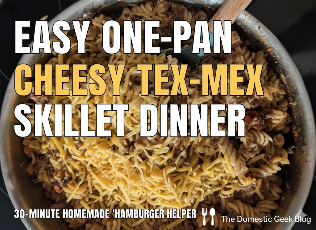 Easy one pan cheesy tex-mex skillet dinner. A stainless steel skillet filled with cheesy ground beef, rotini pasta, and corn, topped with melted colby jack cheese. 